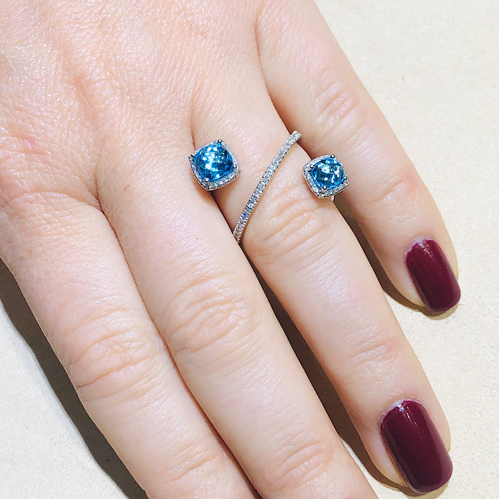 14Kt White Gold Blue Topaz and Diamond open crossover ring